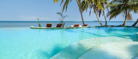 Outdoor pool, free cabanas, pool umbrellas