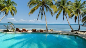 Outdoor pool, free cabanas, pool umbrellas