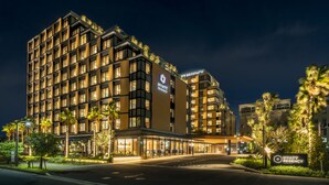 A multi-story hotel with a modern design, featuring a prominent 'Hyatt Regency' sign. - Hyatt Regency Tokyo Bay (Urayasu)