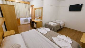 Triple Room | Minibar, desk, blackout curtains, iron/ironing board