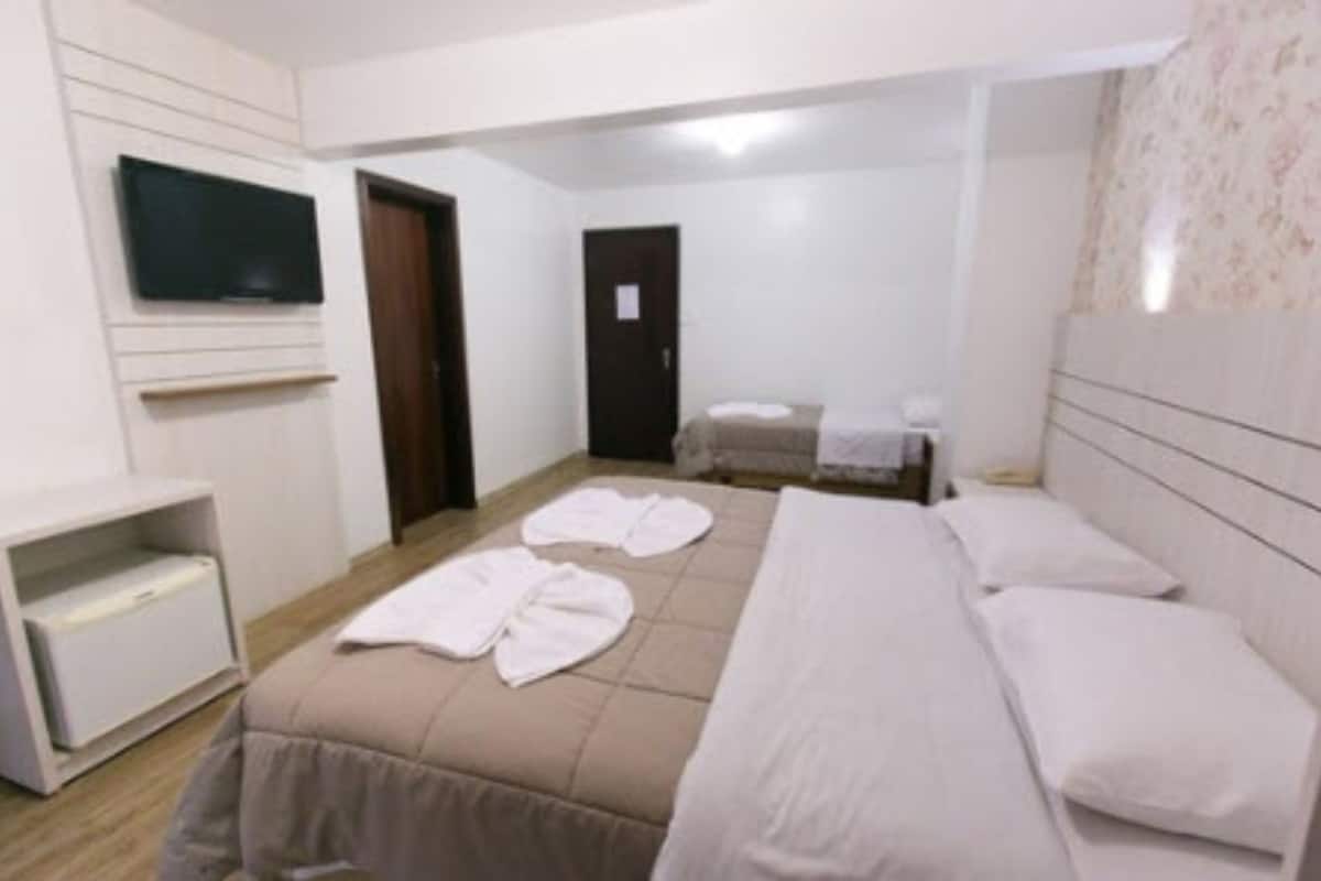 triple room | minibar, desk, blackout curtains, iron/ironing board