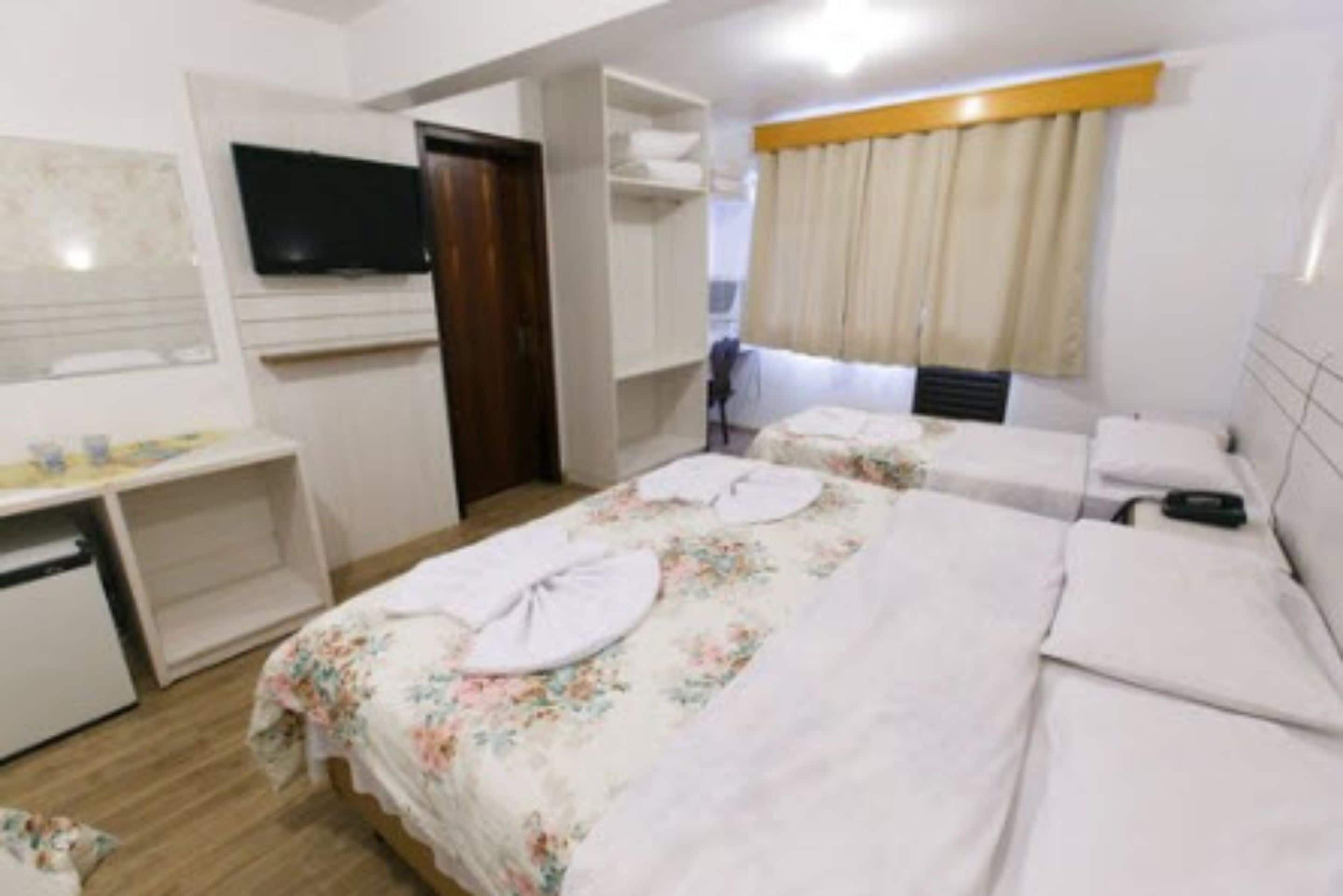 quadruple room | minibar, desk, blackout curtains, iron/ironing board