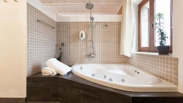 Shower, free toiletries, slippers, towels