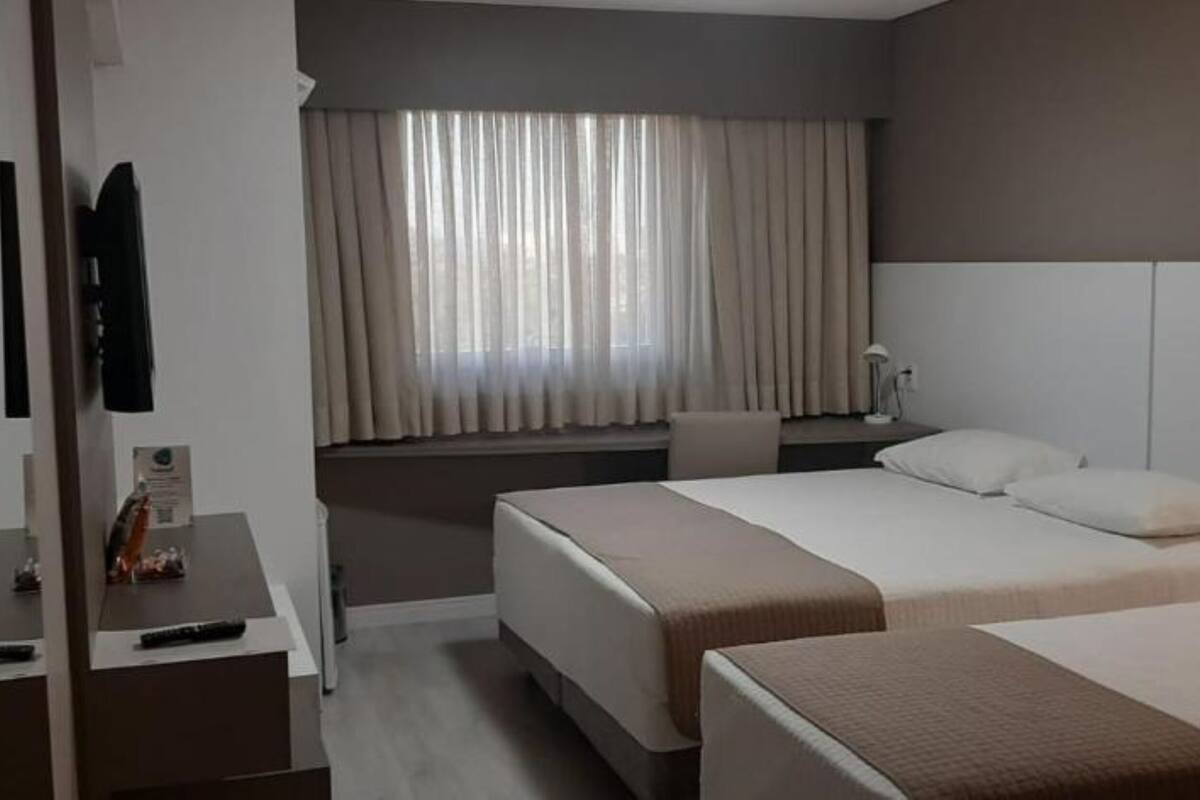 deluxe triple room | minibar, in-room safe, desk, laptop workspace