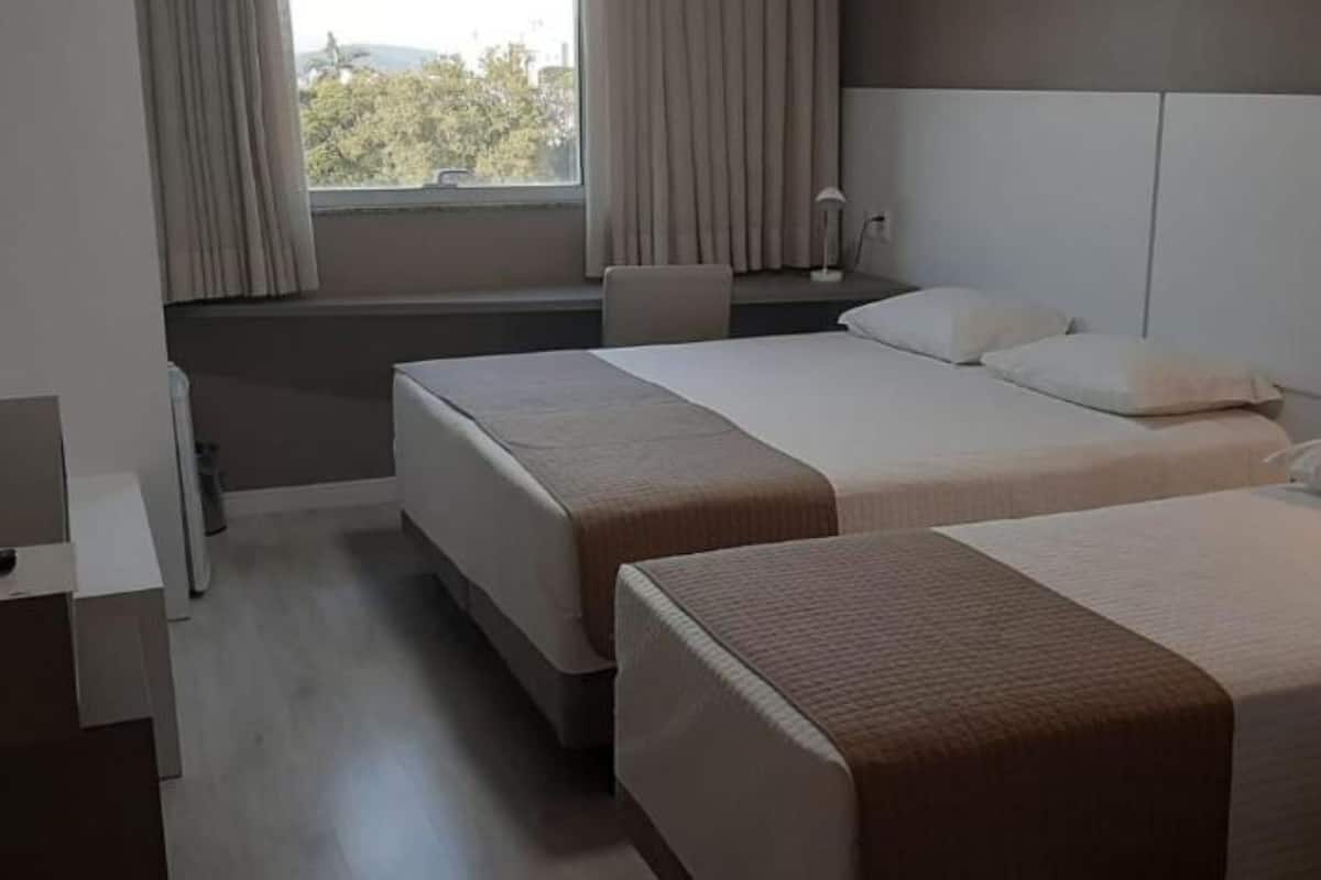 deluxe triple room | minibar, in-room safe, desk, laptop workspace