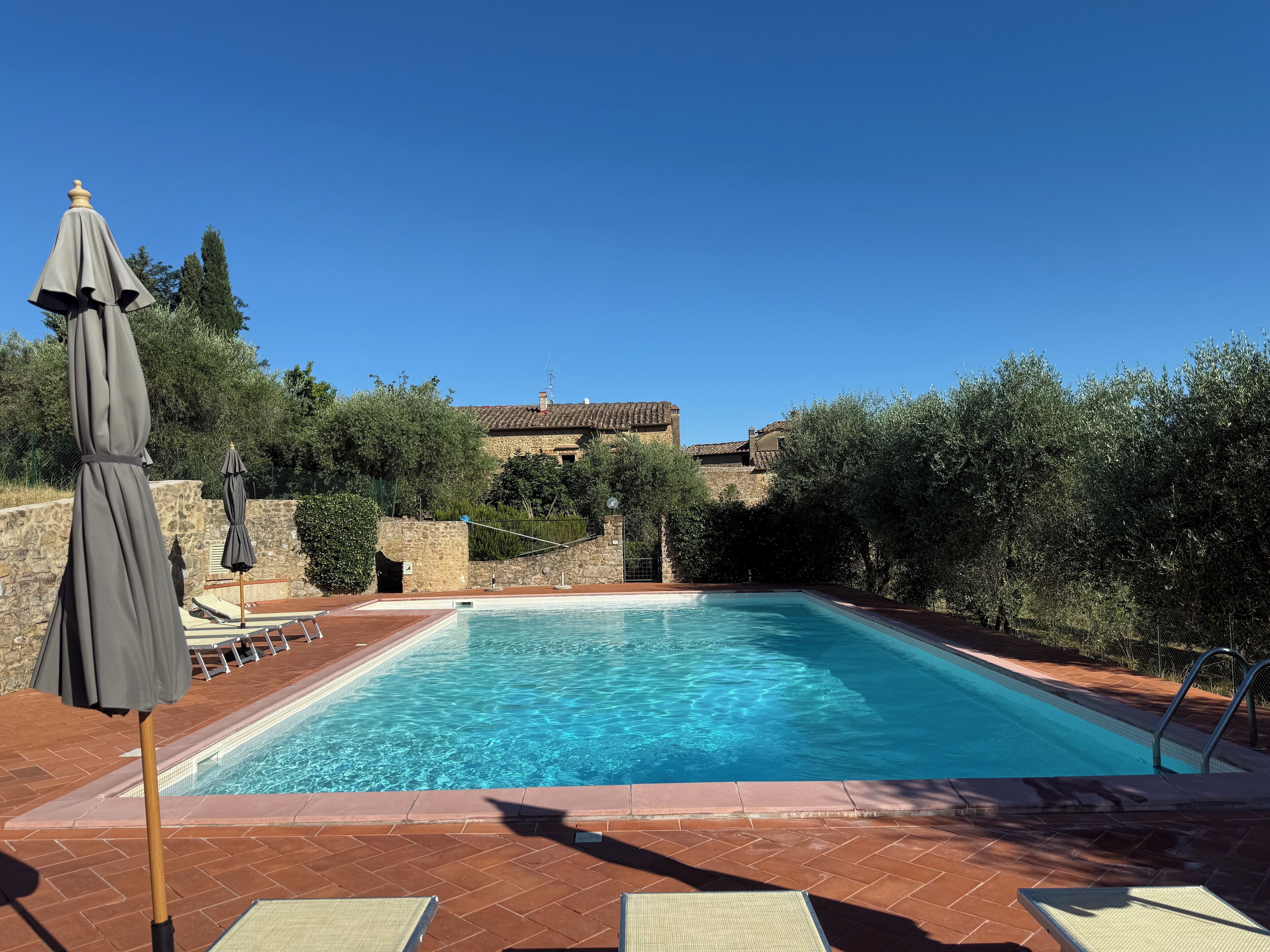 Seasonal outdoor pool, open 8:00 AM to 8:00 PM, pool umbrellas