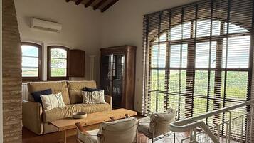 Villa, 3 Bedrooms, Terrace, Hill View (La Stalla, incl. 100€ Cleaning Fee) | Living area | 36-inch flat-screen TV with satellite channels, TV, fireplace