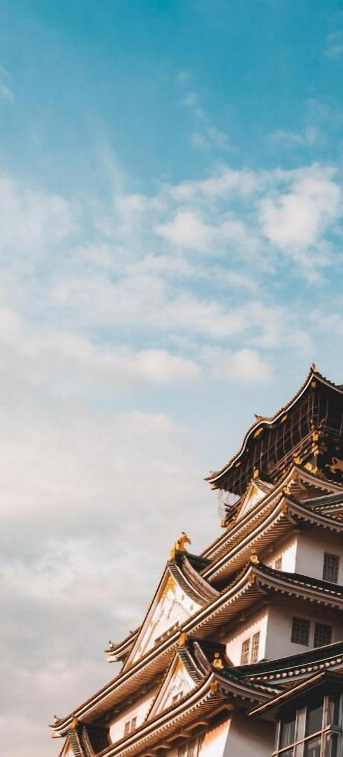 A traditional building with multiple tiers and ornate roof designs.