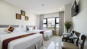 A hotel room with two beds, a desk, a chair, a TV, and a window with a city view. - Hong Chau Hotel (Da Nang)