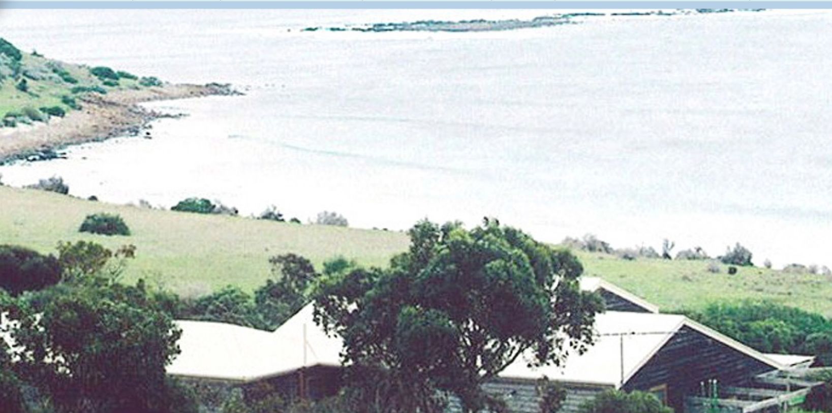 A holiday retreat with a view of a beach and ocean.