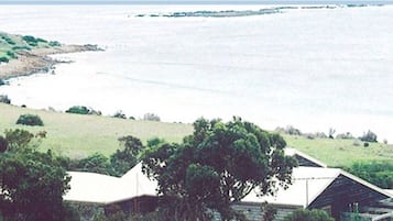 A holiday retreat with a view of a beach and ocean.