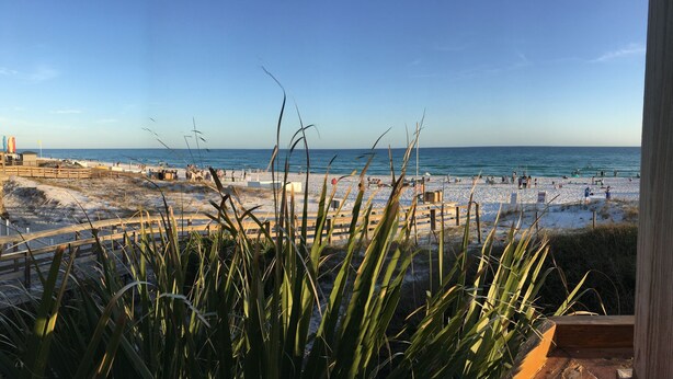 A beach with a wooden fence and a view of the sea. - Beautiful One-Story Cottage Just Minutes From White Sand Beach, with Golf Cart!  (Destin)