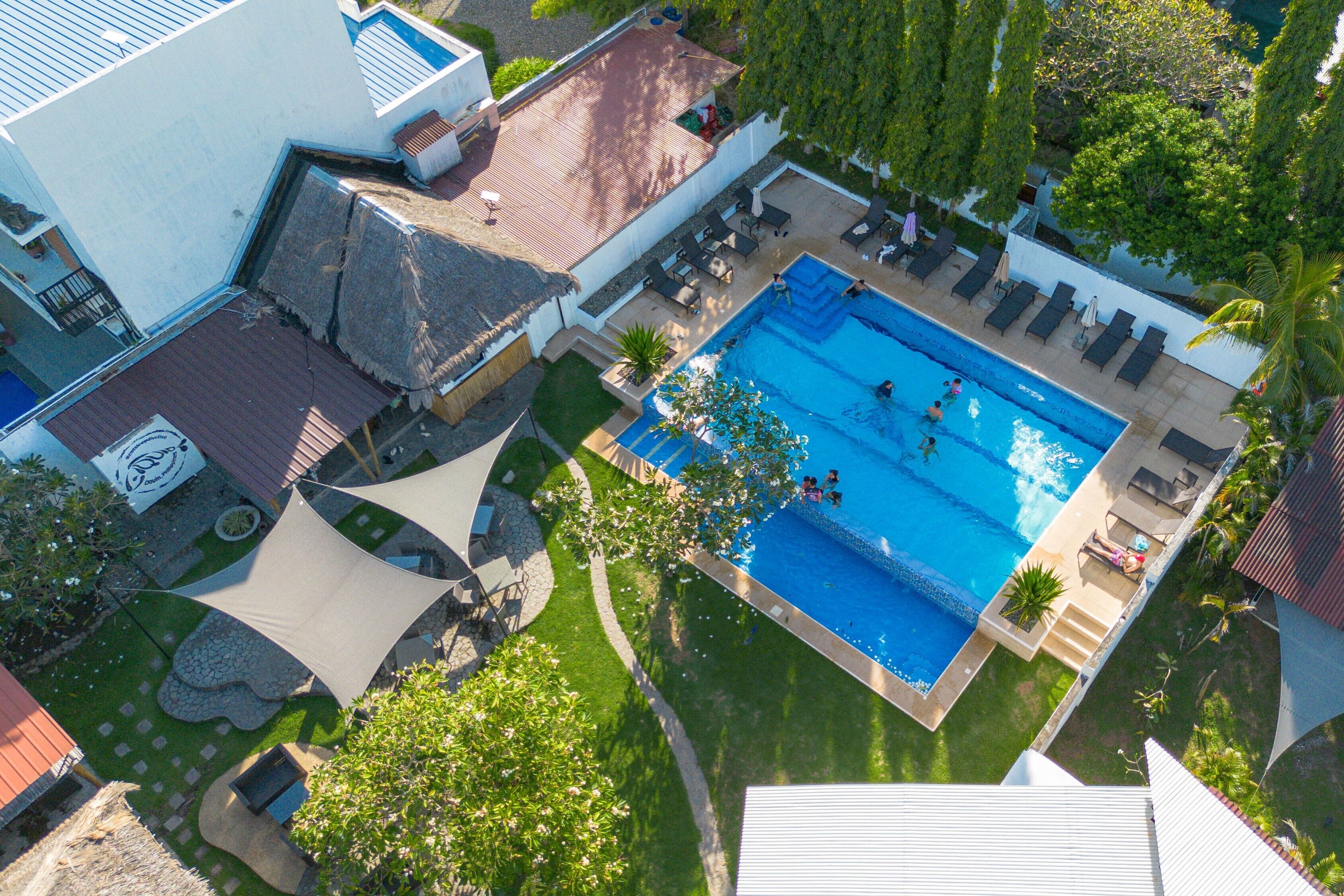2 outdoor pools, pool umbrellas, pool loungers