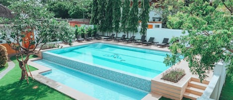 2 outdoor pools, pool umbrellas, pool loungers