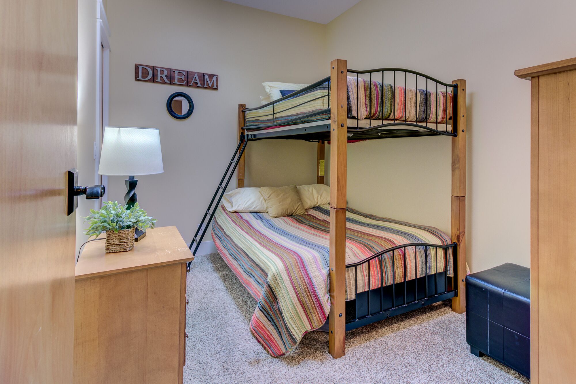 These comfortable bunk beds offer extra fun for your stay. 