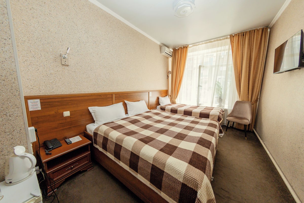 Standard Twin Room, 2 Single Beds, Courtyard View | In-room safe, iron/ironing board, free WiFi, bed sheets
