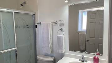 Combined shower/tub, hair dryer, towels, soap