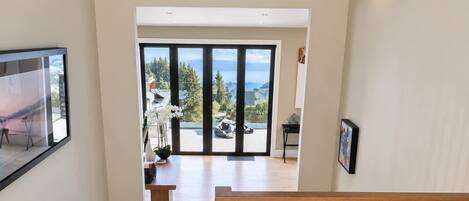 A staircase leading to a living area with a view of the outdoors.