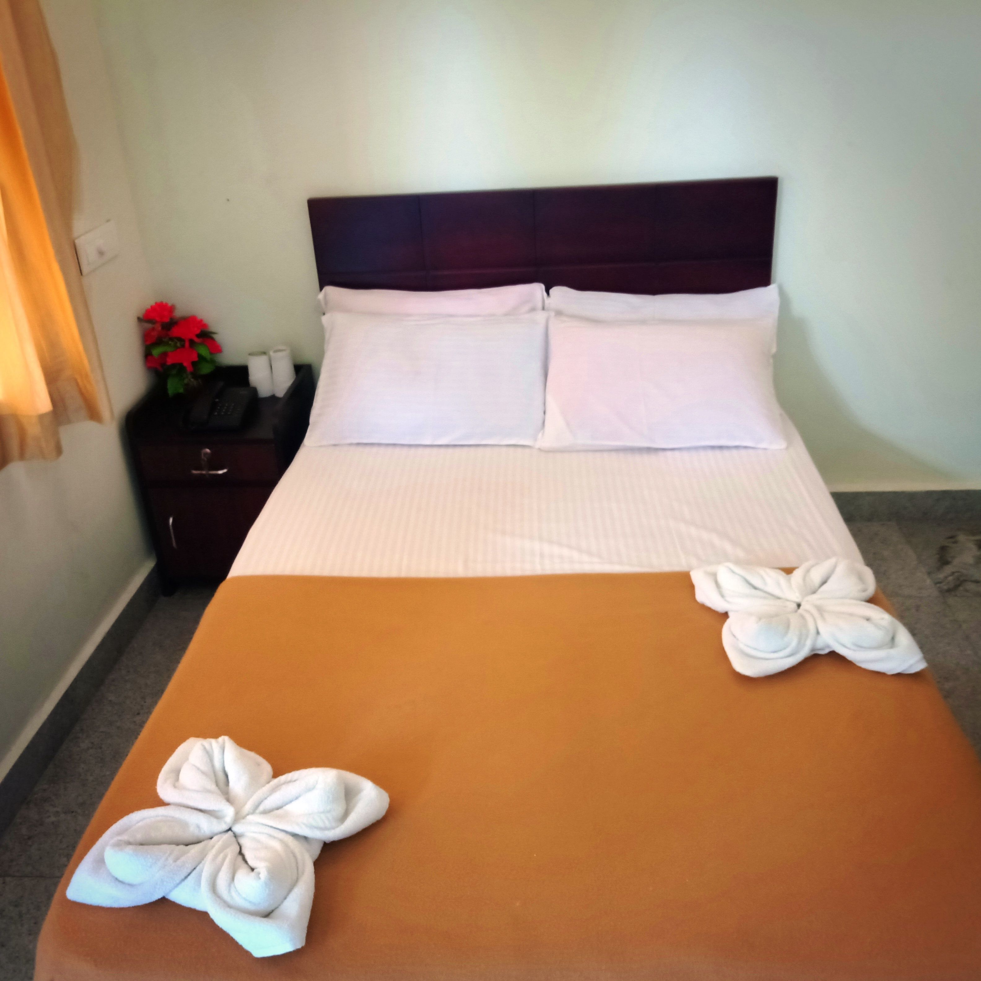 basic double room, 1 double bed, garden view | in-room safe, desk, rollaway beds, bed sheets