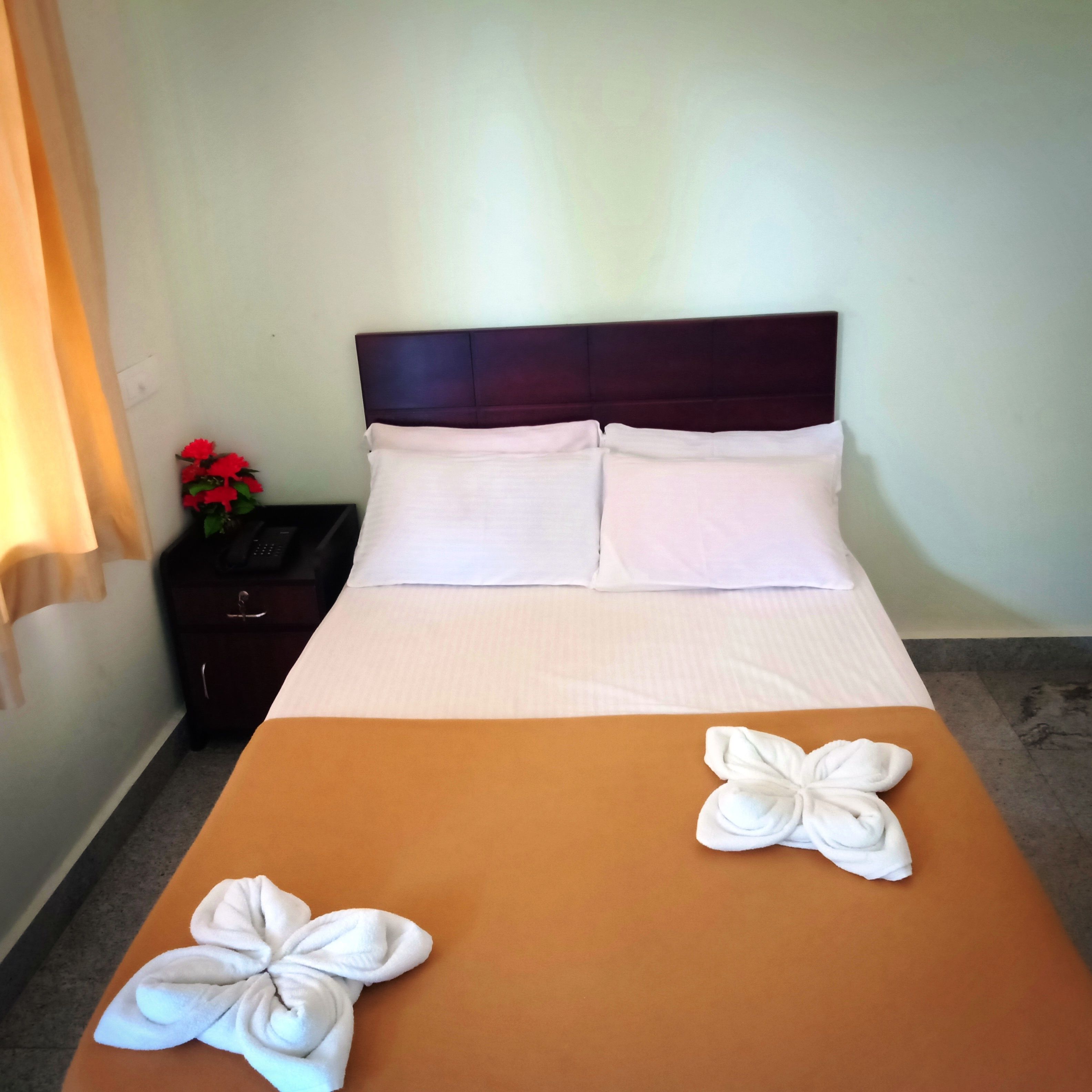 basic double room, 1 double bed, garden view | in-room safe, desk, rollaway beds, bed sheets