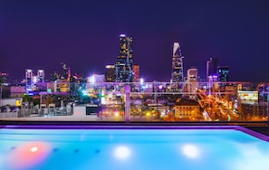 Outdoor pool, open 6:00 AM to 10:00 PM, pool umbrellas, sun loungers - Winsuites Sai Gon Hotel (Ho Chi Minh City)