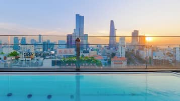 Outdoor pool, open 6:00 AM to 10:00 PM, pool umbrellas, sun loungers