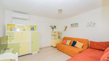 Apartment, 1 Bedroom | Living area | Flat-screen TV
