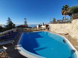 Seasonal outdoor pool, open 9:00 AM to 6:30 PM, sun loungers