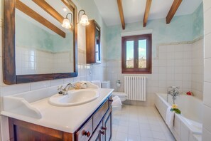 Bathtub, hair dryer, towels