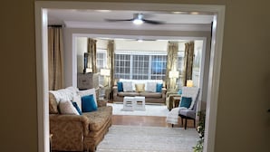A living room with a sofa, armchairs, and a coffee table. - Amazing W Marietta 5BR-3BA Relocation, Long Stay (Marietta)