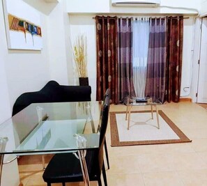 Grand BGC Manila Loft (08L) | Living area | Flat-screen TV