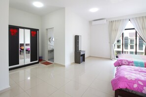 Relax in a spacious room with a large bed, wardrobe, and flat-screen TV.