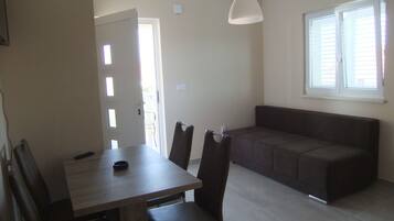 Apartment, 1 Bedroom, Terrace | Living area | 80-cm flat-screen TV with satellite channels, LED TV