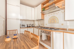 Apartment, 2 Bedrooms | Private kitchen | Full-sized fridge, stovetop, cookware/dishes/utensils