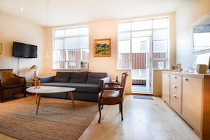 Apartment, 1 Bedroom (141469) | Living area | Flat-screen TV