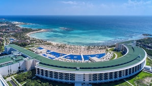 A resort with a central pool, beach area, and ocean views. - Barceló Maya Riviera - Adults Only - All Inclusive (Xpu-Ha)