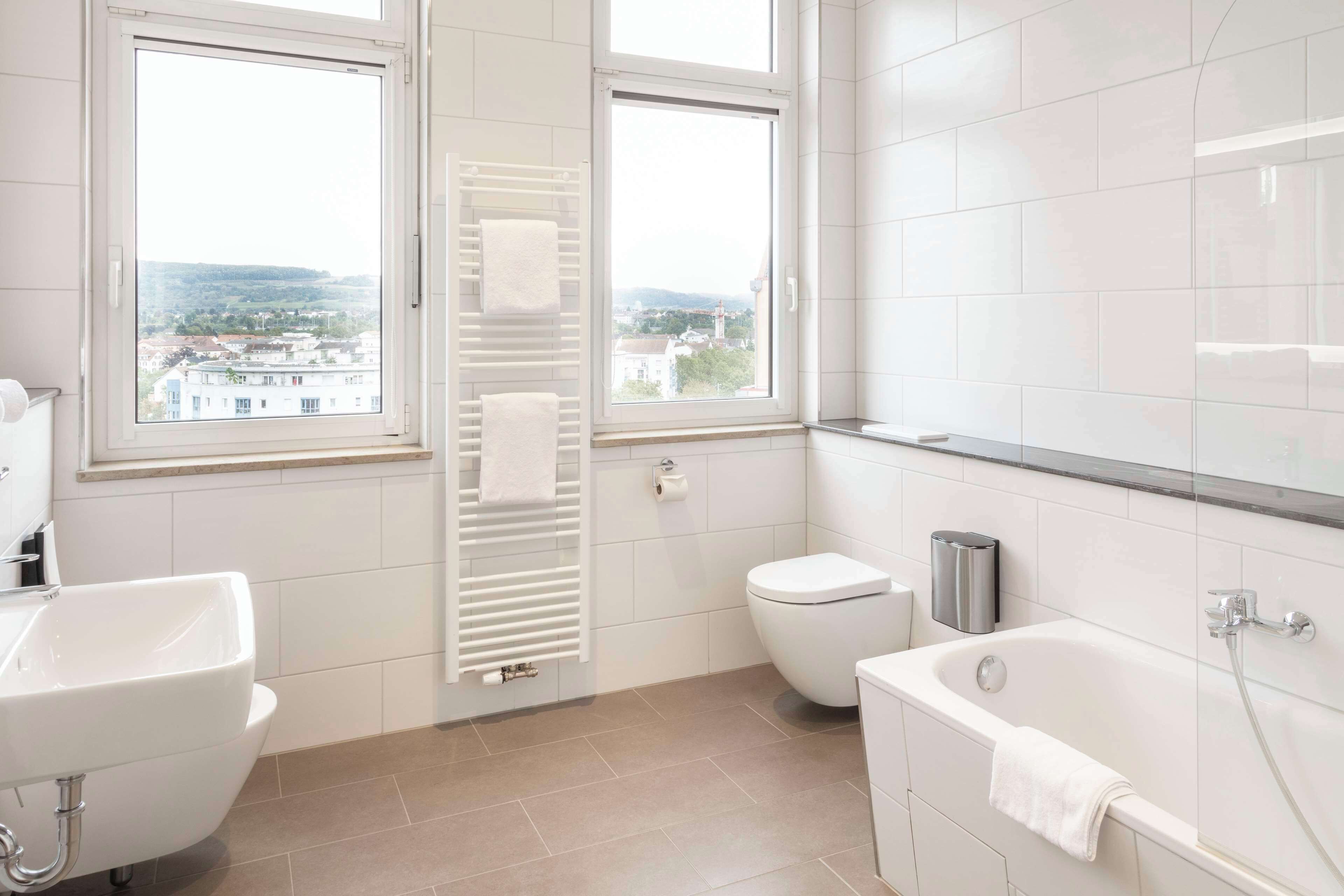 family room, multiple beds | bathroom | hair dryer, towels, soap, shampoo