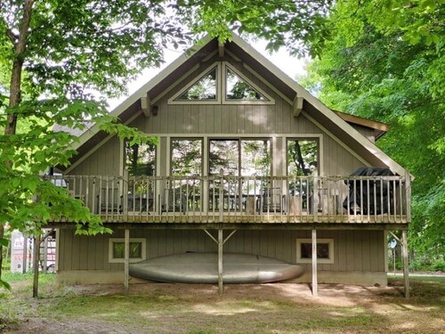 On the Betsie River, fish off dock, close to Crystal Mountain, trails, lakes!