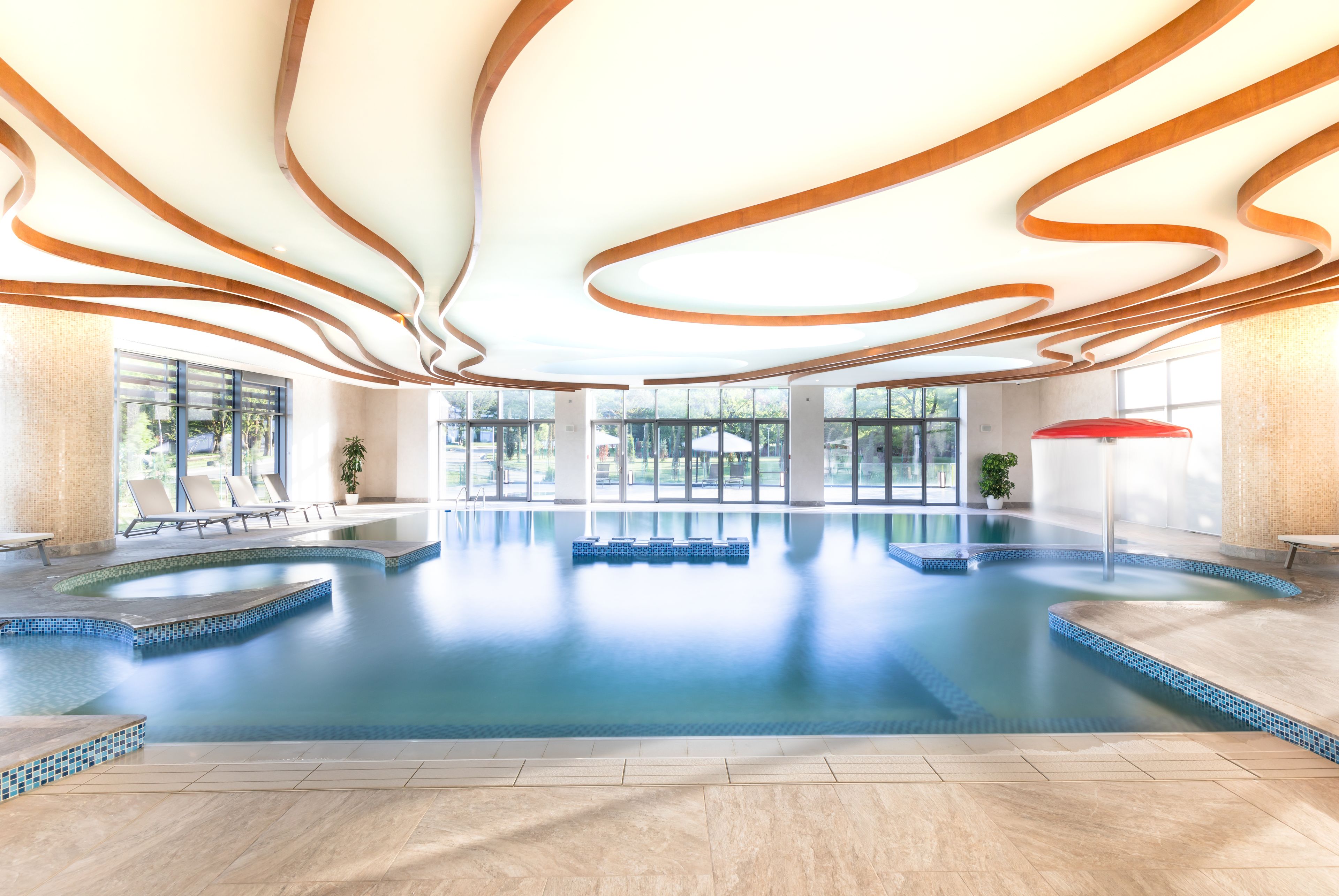 Indoor pool, seasonal outdoor pool, pool umbrellas, pool loungers