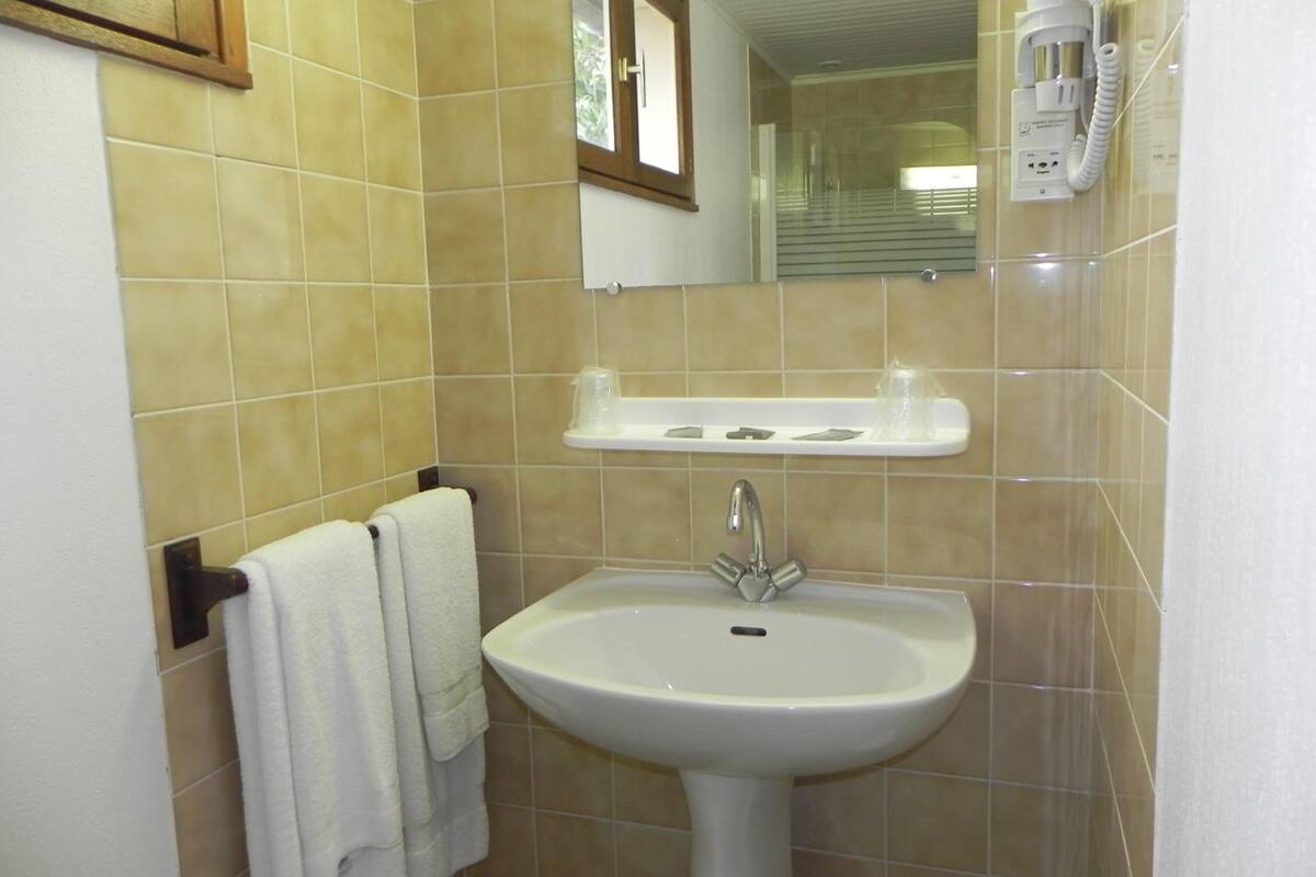 bathtub, hair dryer, towels