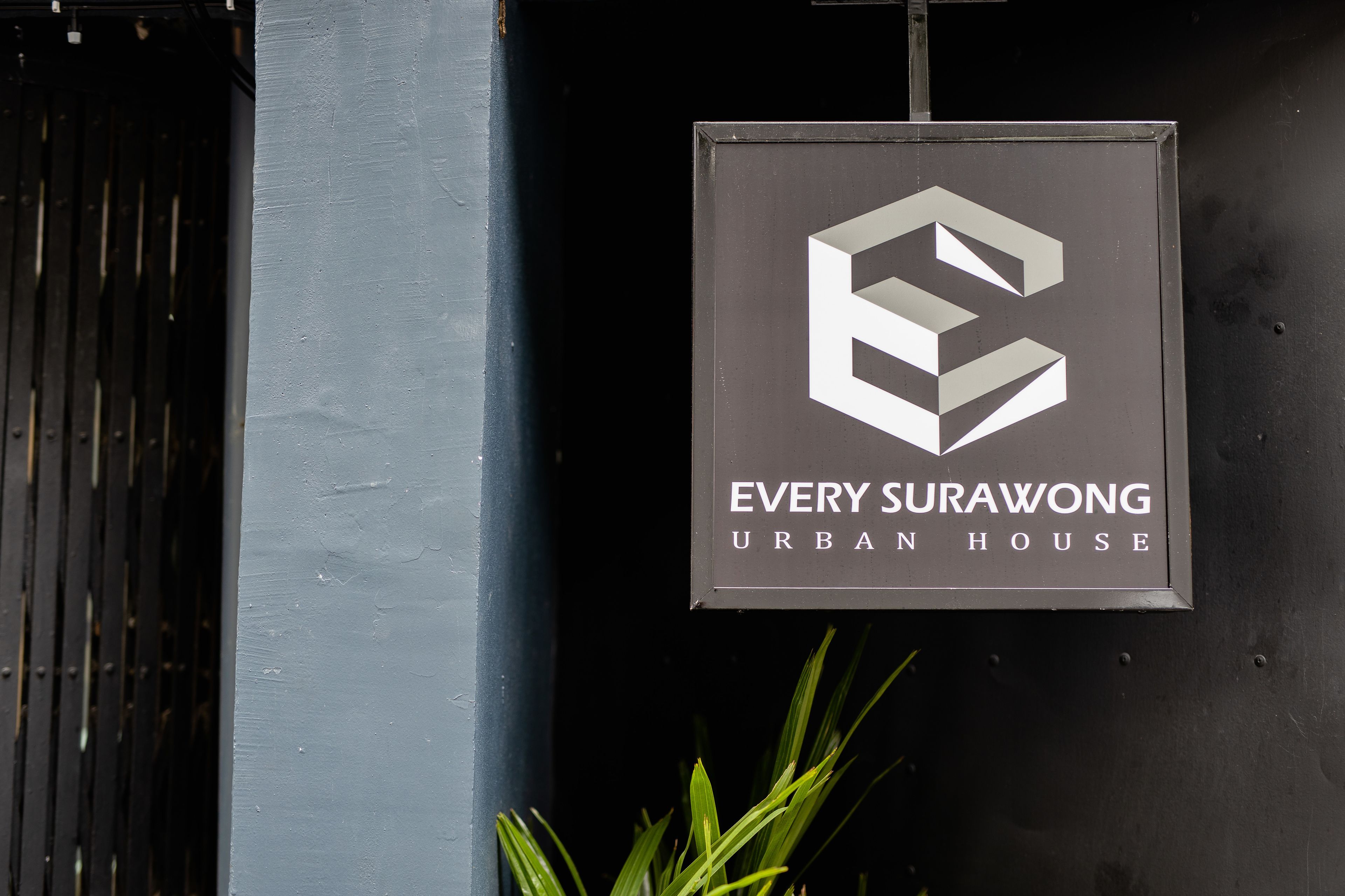 A sign for "Every Surawong Urban House" with a geometric logo.