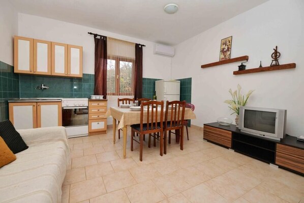 Apartment (Two Bedroom Apartment) | Living room | Flat-screen TV
