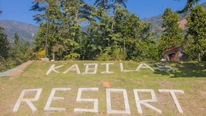 A sign for KABILA RESORT with a mountainous backdrop. - Kabilas Resort and Funpark (Kabilas)