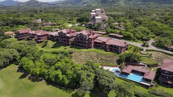 Surrounded by lush gardens and terraced grounds, this resort offers expansive views from its multi-story buildings with balconies.