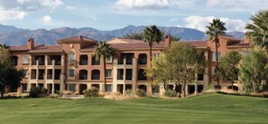 Set amidst mountains, this hotel features arched balconies and a terracotta roof.