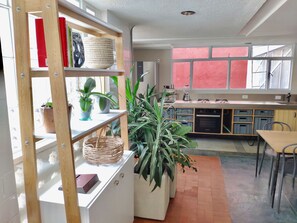 Full-sized fridge, oven, stovetop, cookware/dishes/utensils