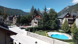 A resort with multiple chalet-style buildings, a swimming pool, and mountainous views. -  4 LIRONES - THE 4 SLEEPYHEAD DORMOUSES  (Benasque)