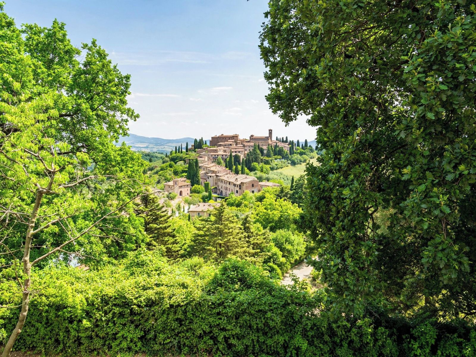 A historic town with traditional architecture nestled in a lush green valley.