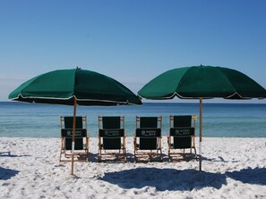 On the beach, sun-loungers