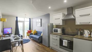 Family Apartment, Multiple Beds | Private kitchen | Full-sized fridge, microwave, oven, dishwasher